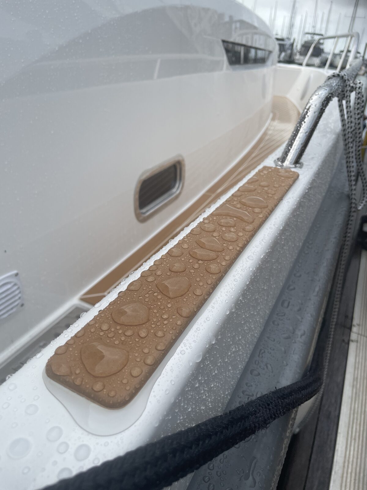 Water beading on white hull and teak step pad